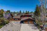 This stunning property boasts a beautiful exterior with a spacious driveway and a charming garage.
