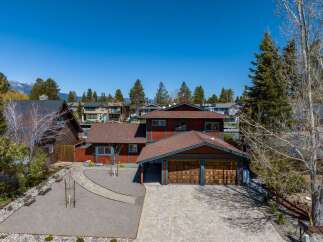 This stunning property boasts a beautiful exterior with a spacious driveway and a charming garage.