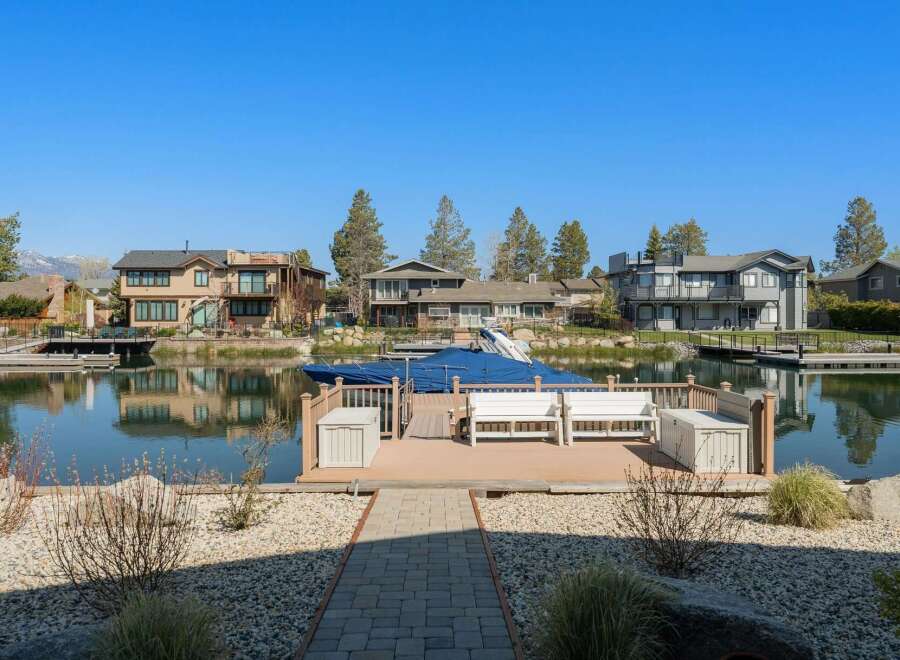 Discover waterfront living at its finest! This stunning property boasts a private dock, perfect for boating and enjoying the serene lake views.