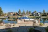 Discover waterfront living at its finest! This stunning property boasts a private dock, perfect for boating and enjoying the serene lake views.