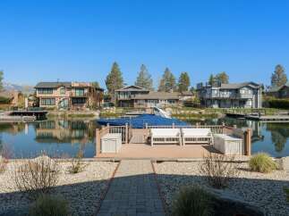 Discover waterfront living at its finest! This stunning property boasts a private dock, perfect for boating and enjoying the serene lake views.