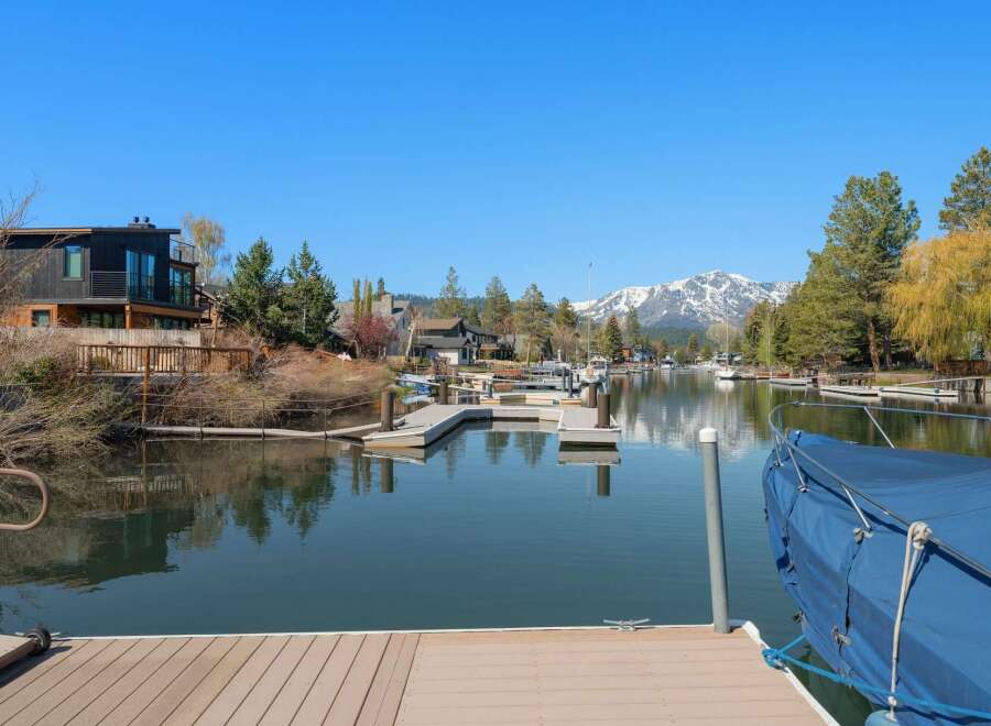 Discover waterfront living at its finest! This stunning property boasts a private dock, perfect for boating and enjoying the serene lake views.
