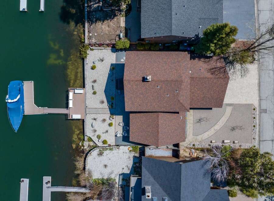 Discover waterfront living at its finest! This stunning property boasts a private dock, perfect for boating and enjoying the serene lake views.