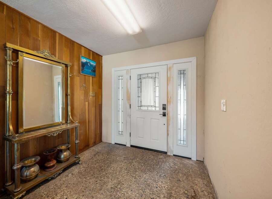 Step into this inviting entryway, showcasing a blend of classic and unique design elements.