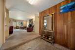 Step into this inviting home featuring a cozy living space with a fireplace and a dining area.