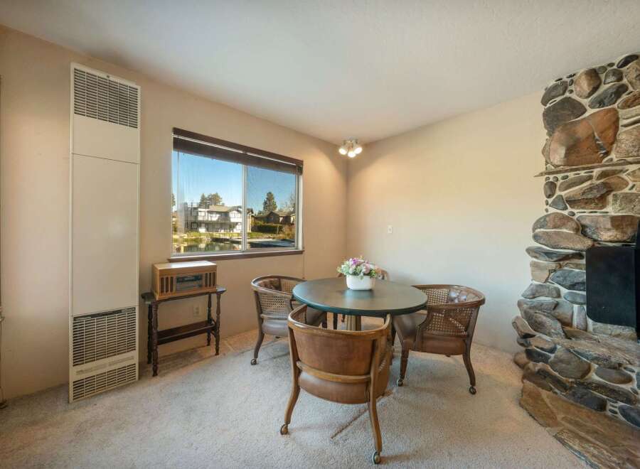 This charming dining area features a cozy round table and stylish chairs, perfect for intimate gatherings.