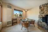 This charming dining area features a cozy round table and stylish chairs, perfect for intimate gatherings.