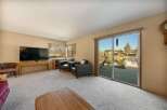 Enjoy stunning waterfront views from this inviting living room.
