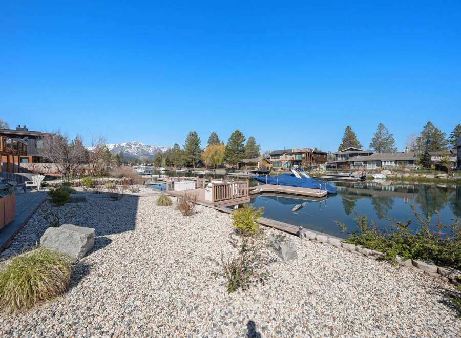 Discover waterfront living at its finest! This stunning property boasts a private dock, perfect for boating and enjoying the serene lake.