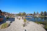 Discover waterfront living at its finest! This stunning property boasts a private dock, perfect for boating and enjoying the serene lake.