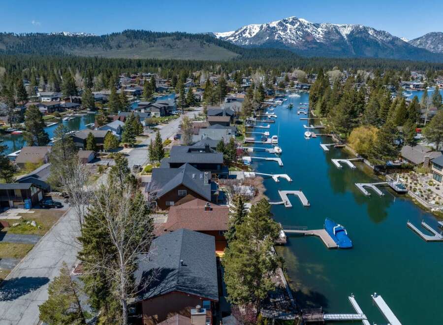 Discover waterfront living at its finest! This stunning property boasts direct access to a serene lake, perfect for boating and water activities.