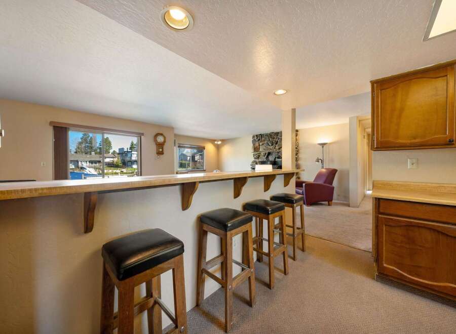 This stunning property boasts a stylish bar area, perfect for entertaining guests.