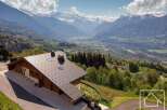 Discover your dream alpine retreat! This stunning property boasts breathtaking mountain views and a modern design.