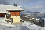 Discover a stunning property nestled in a winter wonderland, offering breathtaking mountain views.