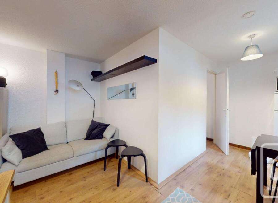 Discover this charming property featuring a cozy living space with a comfortable sofa and stylish decor.