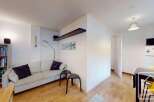 Discover this charming property featuring a cozy living space with a comfortable sofa and stylish decor.