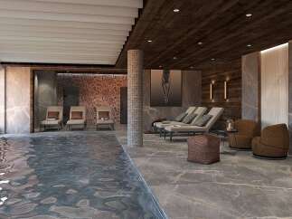 Indulge in luxury at this stunning spa retreat, featuring a serene indoor pool with breathtaking mountain views.
