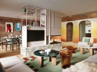 Experience luxury living in this stunning property, featuring a modern fireplace and a stylish living area.