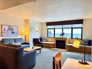 This stunning living room boasts a cozy fireplace, perfect for relaxing evenings.