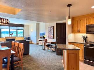 Step into luxury with this stunning property, featuring a modern kitchen with sleek appliances and ample counter space.
