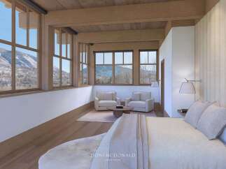Experience luxury living in this stunning bedroom with breathtaking mountain views.