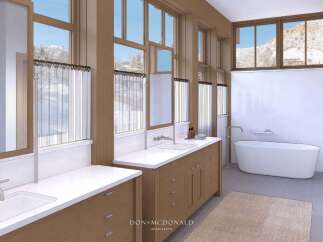 This luxurious bathroom boasts stunning mountain views through expansive windows, creating a serene and inviting atmosphere.