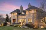 This stunning property showcases a luxurious exterior with a blend of modern and classic design elements.