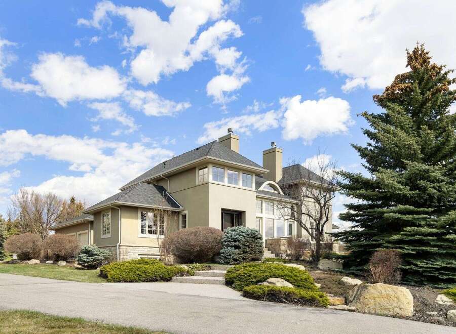 This stunning property boasts a beautiful exterior with a well-manicured landscape.