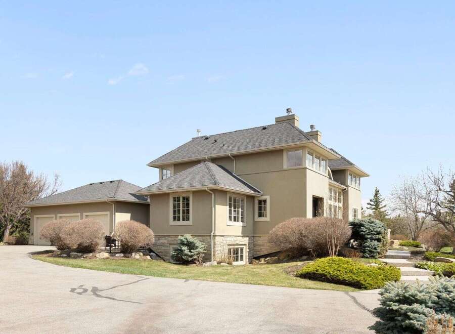 This stunning property boasts a beautifully designed exterior with a modern aesthetic.
