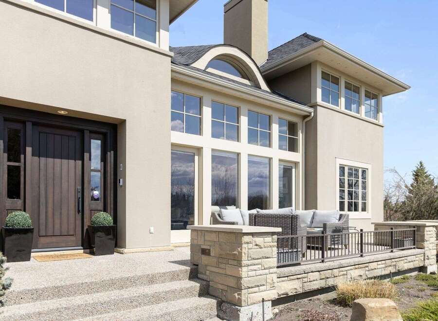 This stunning property boasts a modern exterior with a welcoming entrance.