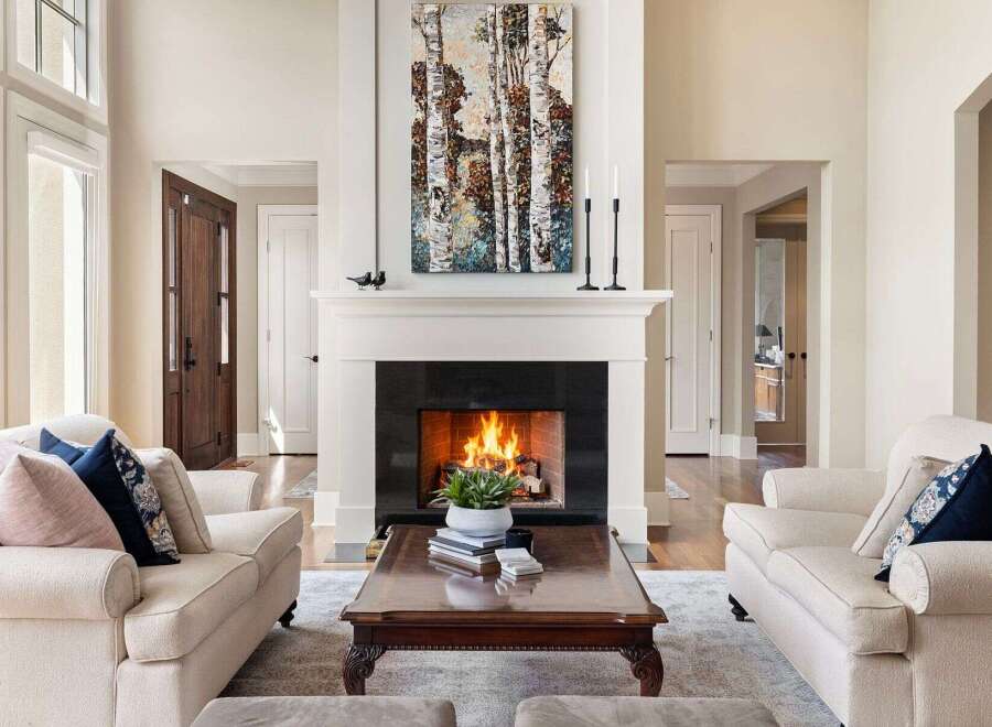 Experience luxury living in this stunning property, featuring a cozy fireplace perfect for chilly evenings.