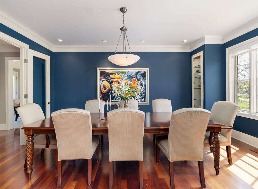 Step into luxury with this stunning dining room! Featuring a beautiful wooden dining table and elegant chairs, this space is perfect for hosting memorable gatherings.