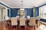 Step into luxury with this stunning dining room! Featuring a beautiful wooden dining table and elegant chairs, this space is perfect for hosting memorable gatherings.