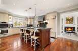 This stunning kitchen boasts a spacious island with seating, perfect for entertaining or casual dining.
