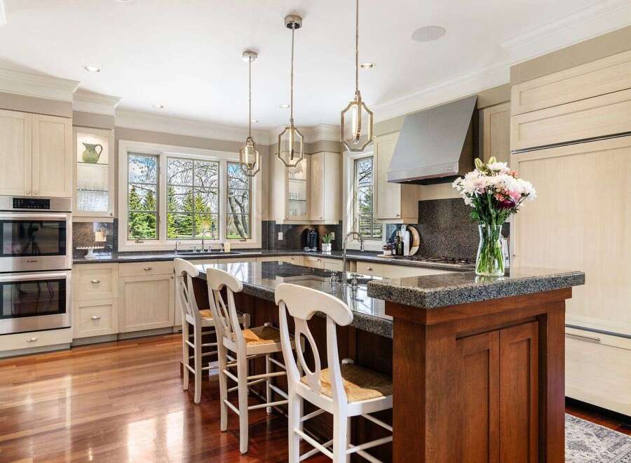 This stunning kitchen boasts a modern design with high-end appliances and ample counter space.