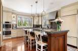 This stunning kitchen boasts a modern design with high-end appliances and ample counter space.