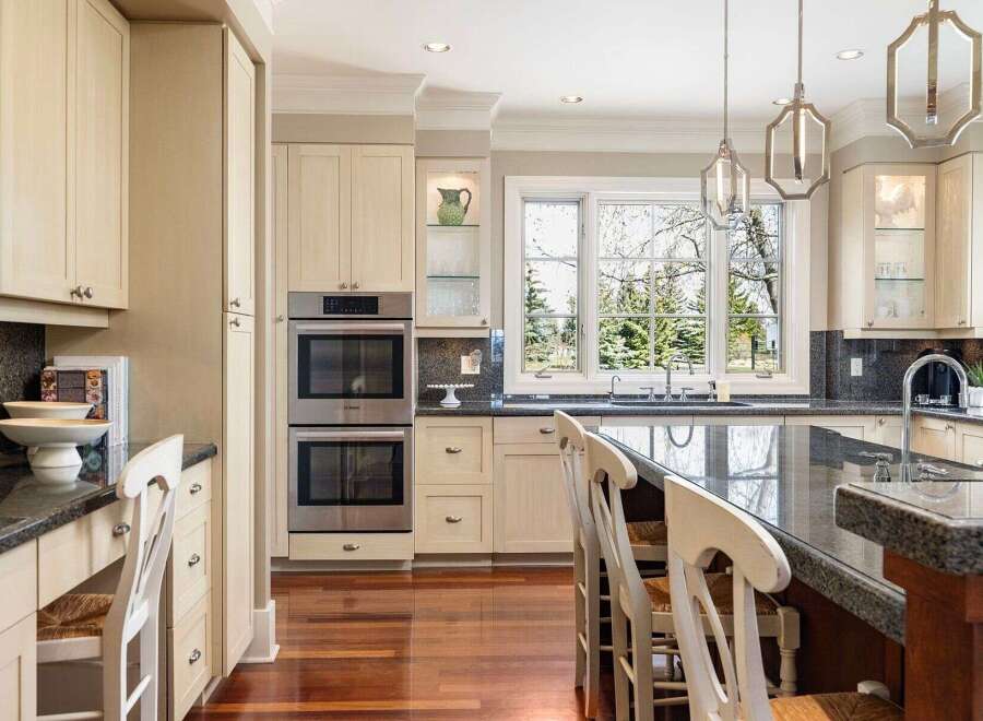 This stunning kitchen boasts a modern design with high-end appliances and ample counter space, perfect for culinary enthusiasts.