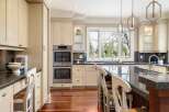 This stunning kitchen boasts a modern design with high-end appliances and ample counter space, perfect for culinary enthusiasts.