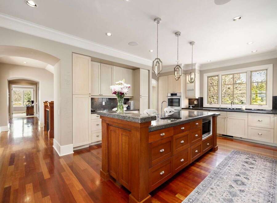 Step into luxury with this stunning kitchen! Featuring a spacious island with ample storage and a sleek countertop, this kitchen is perfect for both cooking and entertaining.