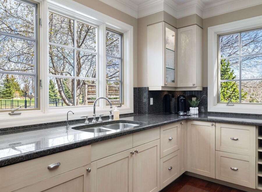 This stunning kitchen boasts a bright and airy atmosphere, perfect for culinary creations and entertaining.