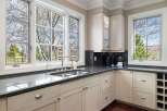 This stunning kitchen boasts a bright and airy atmosphere, perfect for culinary creations and entertaining.