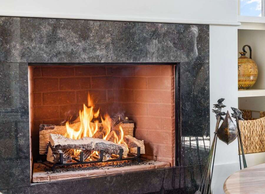 Enjoy cozy evenings by the fireplace in this stunning property.