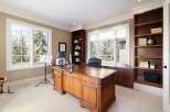 This stunning office space boasts a classic design with rich wood finishes and ample natural light.
