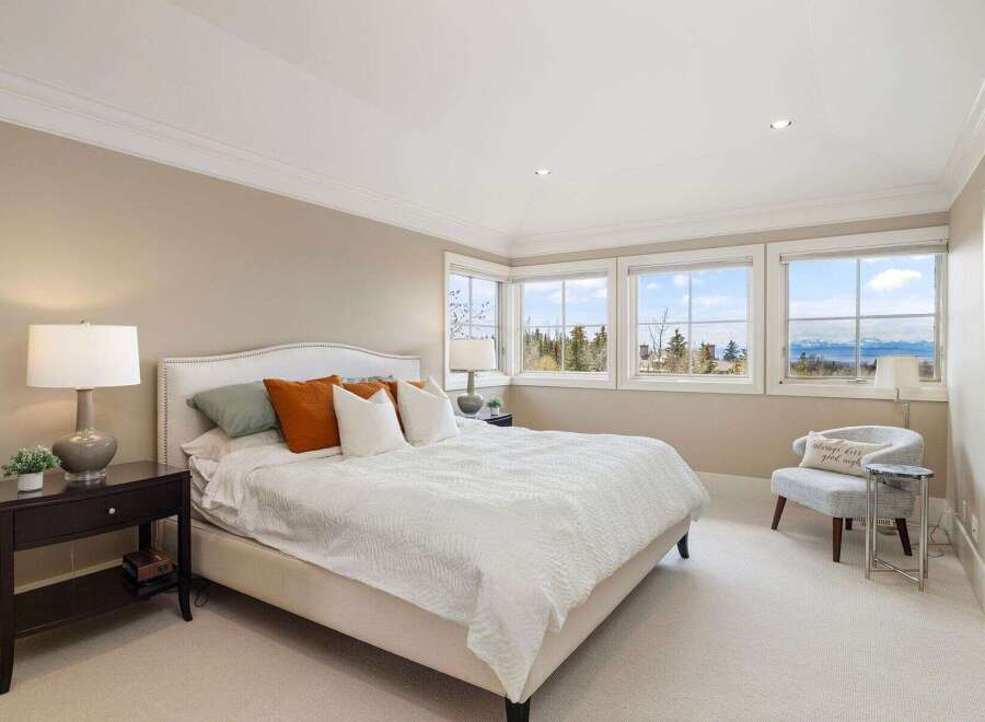 This stunning bedroom boasts a bright and airy atmosphere, perfect for relaxation.