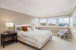 This stunning bedroom boasts a bright and airy atmosphere, perfect for relaxation.