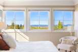 Enjoy breathtaking mountain views from this stunning bedroom.