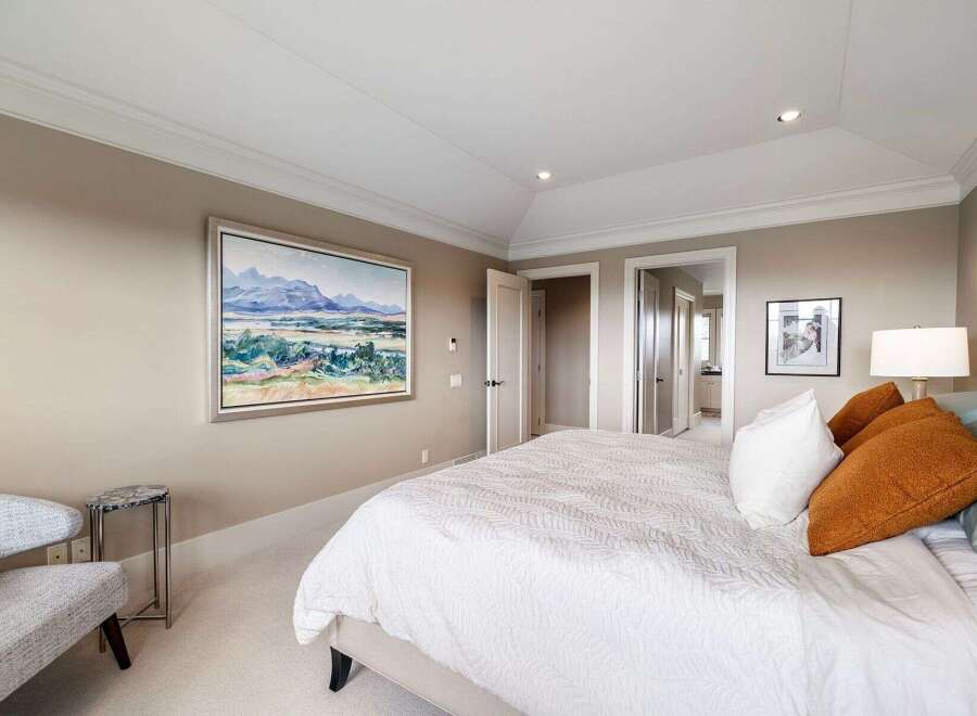 Step into luxury with this stunning bedroom, featuring a serene color palette and elegant design.