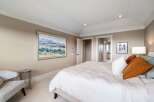 Step into luxury with this stunning bedroom, featuring a serene color palette and elegant design.