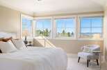 Experience luxury living in this stunning bedroom with breathtaking views.