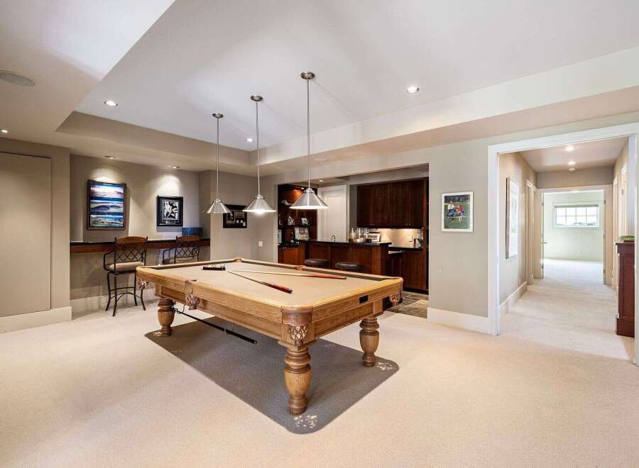 This stunning property boasts a luxurious game room, perfect for entertaining guests.